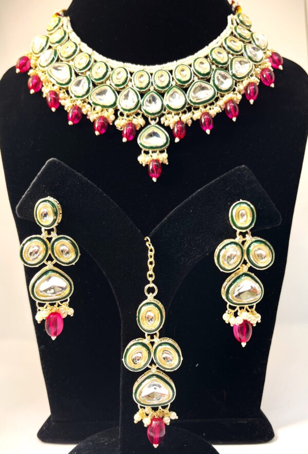 TB Kundan jadau set with Green border Meenakari and fine cut cabochons