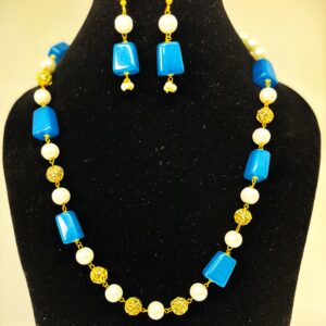 TB pearl strings set with Blue natural stone and studded gold bids