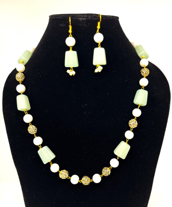 TB pearl strings set with Sea Green natural stone and studded gold bids - Image 2