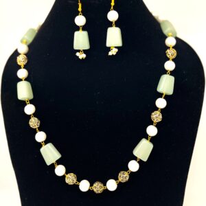 TB pearl strings set with Sea Green natural stone and studded gold bids