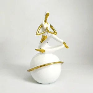 Experience calm and mindfulness through art with this beautifully handcrafted gold-and-white yoga figurine from the Toombox Serenity Collection. The meditative posture represents peace, balance, and inner harmony — making it a perfect accent for modern homes, offices, or wellness studios. A timeless piece that inspires tranquility wherever it’s placed.