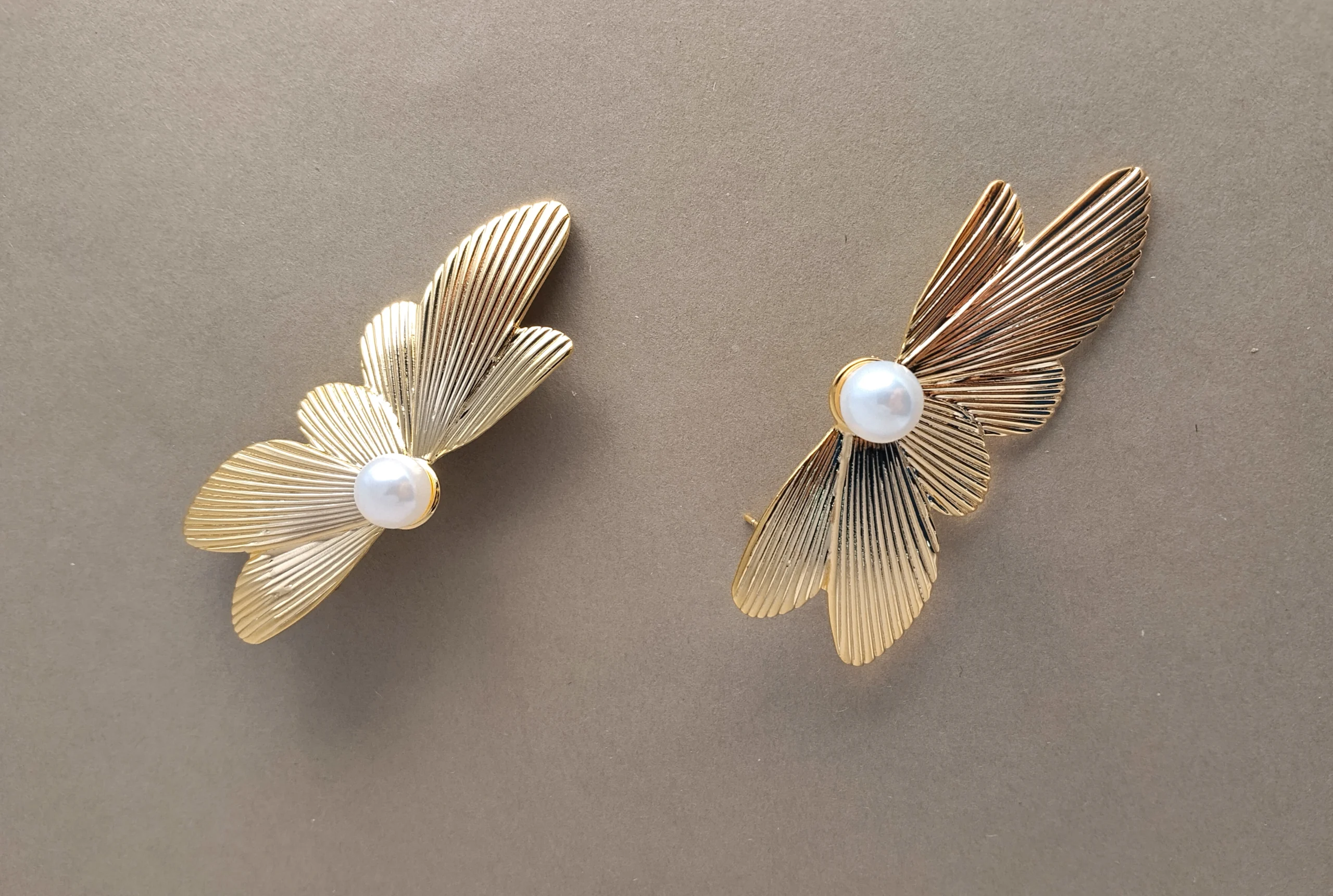 Textured Gold Wing & Pearl Statement Earrings - Image 3